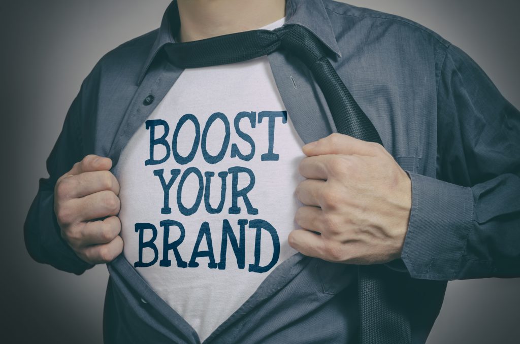 Man showing Boost Your Brand tittle on t-shirt