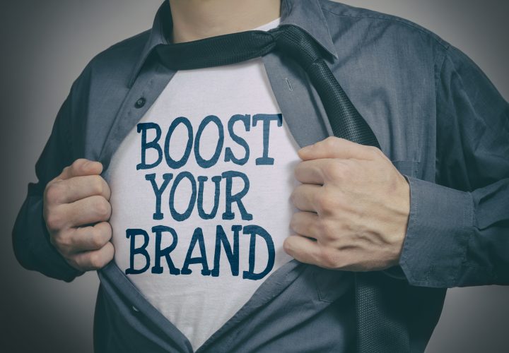 Man showing Boost Your Brand tittle on t-shirt